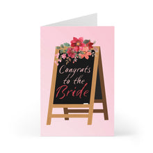 Load image into Gallery viewer, The Cute Bridal Shower Card or Engagement Card for the Bride to Be from R is for Robo features a delightful wooden chalkboard easel with the elegant message "Congrats to the Bride." It is beautifully decorated with red and pink flowers at the top, perfectly celebrating the bride-to-be against a soft pink background.