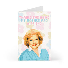 Load image into Gallery viewer, This R is for Robo product, the "Betty White Mothers Day Card for Mom from Daughter - Pop Culture Gifts," showcases a joyful woman with curly hair in a blue shirt, set against a backdrop of colorful pastel flowers. The card features the heartfelt message, "Thanks for being my mother and a friend," perfectly blending pop culture charm with the warmth of a handwritten note.