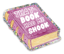 Load image into Gallery viewer, Featuring a glittery border for added flair, the "Book Had Me Shook Funny Book Lover Sticker" by R is for Robo showcases an illustration of a purple book with bold white text stating "That Book Had Me Shook," making it perfect for any passionate reading enthusiast.