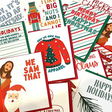 Load image into Gallery viewer, Discover the Oops Seconds Christmas Cards by R is for Robo, a vibrant collection of slightly imperfect holiday greeting cards featuring festive designs and playful themes. Enjoy sayings like "Merry Christmas," "We Saw That" with Santa, and "Don We Now Our Ugly Apparel" accompanied by a sweater illustration.