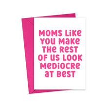 Load image into Gallery viewer, A vibrant hot pink card from R is for Robo humorously declares in bold letters, "Moms like you make the rest of us look mediocre at best." Paired with a bright pink envelope, this Funny Mother's Day Card for Mom, Sister or Friend adds a playful touch to your heartfelt handwritten note.