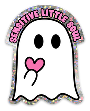 Load image into Gallery viewer, Adorned with a holographic border, the Funny Ghost Sticker - Sensitive Little Soul by R is for Robo features an adorable ghost with big black eyes holding a pink heart. The phrase "SENSITIVE LITTLE SOUL" arches above in pink letters, making it an ideal way to add charm to your Halloween decorations. Constructed from durable vinyl, this cute sticker will surely amuse everyone.