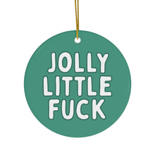 Load image into Gallery viewer, Adding a touch of sassy holiday decor, the Jolly Little Fuck Funny Christmas Ornament by R is for Robo is a round green piece with bold white text. It's perfect for those who appreciate cheekiness in their festive celebrations, hanging elegantly by a thin yellow string.