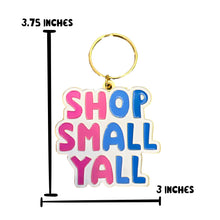 Load image into Gallery viewer, The Shop Small Yall Keychain by R is for Robo displays the vibrant phrase "SHOP SMALL YALL" in pink and blue letters. Created to honor community commerce, it measures 3.75 inches by 3 inches and comes with a gold-colored keyring at the top, making it a perfect way to show support for local businesses.