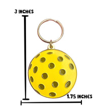 Load image into Gallery viewer, Introducing the Pickleball Ball Enamel Keychain from R is for Robo! This vibrant yellow keychain boasts a round pickleball design with distinctive black circles, measuring 3 inches in height and 1.75 inches in diameter. It's the perfect pickleball accessory to add charm to your keys or bag.