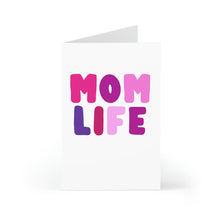 Load image into Gallery viewer, An amusing greeting card from R is for Robo stands upright against a white background, featuring the bold and colorful pink and purple letters spelling "Mom Life," making it an ideal funny card for Mother's Day.