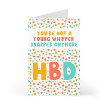 Load image into Gallery viewer, Introducing the R is for Robo "Whipper Snapper" Birthday Card, a humorous greeting card ideal for him or her. It boasts a vibrant polka dot design with a handwritten note inside, declaring, "YOU'RE NOT A YOUNG WHIPPER SNAPPER ANYMORE" in bold letters. The card also features "HBD" prominently at the bottom and is accompanied by a classic Kraft envelope for that personal touch.