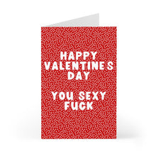 Load image into Gallery viewer, The Funny Valentines Day Card for Him or Her by R is for Robo features a red design with white polka dots and bold white text that reads, "Happy Valentines Day You Sexy Fuck." This amusing card stands upright, offering a cheeky and charming way to express your message.