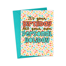 Load image into Gallery viewer, Introducing the "Funny Birthday Card for Him or Her – Personal Holiday" from R is for Robo. This vibrant card features a backdrop of multicolored stars and playful, bold text that reads, "It's your Birthday AKA your own Personal Holiday." Accompanied by a teal envelope, it's perfect for adding a personal touch with a handwritten note inside.