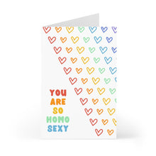 Load image into Gallery viewer, The "Homo Sexy Funny Gay Valentines Day Card or Gay Anniversary Card" by R is for Robo is a lively Rainbow Card featuring the phrase "YOU ARE SO HOMO SEXY" in rainbow-colored letters. The background highlights a diagonal design with colorful heart outlines in various rainbow hues.
