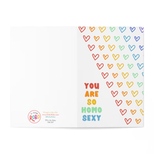 Load image into Gallery viewer, Featuring a rainbow gradient of colorful hearts along the right side, this vibrant card by R is for Robo showcases the centered message, "YOU ARE SO HOMO SEXY." In the bottom left corner, you'll find a circular logo and contact information. This card is perfect for Valentine's Day or as a Gay Anniversary Card.