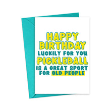 Load image into Gallery viewer, This humorous birthday card, by R is for Robo, comes with a blue envelope and features a bold message in yellow and green letters: "Happy Birthday. Luckily for you, pickleball is a great sport for old people." It's the ideal pickleball-themed birthday card to share some laughs.