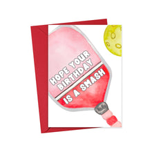 Load image into Gallery viewer, The Pickleball Birthday Card from R is for Robo showcases a humorous design with a red pickleball paddle and a yellow pickleball. The paddle text reads, "Hope your birthday is a smash." Ideal as a one-of-a-kind gift for any pickleball lover, the card comes complete with a matching red envelope to make any celebration unforgettable.