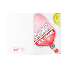 Load image into Gallery viewer, Introducing the Pickleball Birthday Card by R is for Robo, a delightful greeting card featuring a vibrant pinata stick illustration next to a round ball reminiscent of a pinata. The playful message on the stick reads, "Hope your birthday is a smash." This card's colorful and humorous design makes it an ideal choice for pickleball enthusiasts who enjoy lighthearted birthday surprises.