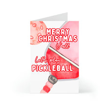 Load image into Gallery viewer, Celebrate the holiday season with the Pickleball Christmas Card from R is for Robo. This vibrant card showcases a red pickleball paddle and ball, adorned with festive greetings in bold red letters: "Merry Christmas Y'all" and "Let's play Pickleball." It's an ideal addition to any collection of pickleball gifts for him or her.