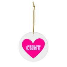 Load image into Gallery viewer, A round Christmas ornament from R is for Robo, featuring a pink heart in the center with bold white text spelling "CUNT." This humorous ornament hangs from a thin gold string, making it an ideal sweary gift for those who appreciate an inappropriate holiday touch.