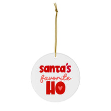 Load image into Gallery viewer, The "Santa's Favorite Ho - Funny Christmas Ornament for Her" by R is for Robo is a sassy Christmas gift, featuring a round white design with "Santa's Favorite HO" in bold red and pink letters. It hangs by a thin gold string and includes a small heart shape nestled within the letter O.