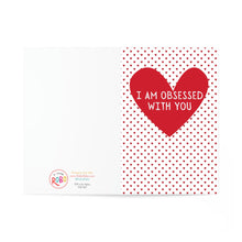Load image into Gallery viewer, The Funny Valentine Greeting Card for Boyfriend or Girlfriend by R is for Robo features a heavyweight matte card with a large red heart and the text I am obsessed with you. Small red hearts decorate the white background, with a logo and hand-written note on the left adding charm.
