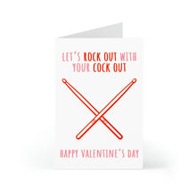 Load image into Gallery viewer, The Funny and Dirty Valentines Day Card for Him by R is for Robo features crossed red drumsticks with the text Let’s rock out with your cock out on top and Happy Valentines Day below, making it a quirky gift that stands upright, ready to elicit laughs.