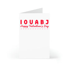 Load image into Gallery viewer, The Funny and Dirty Valentines Day Card for Him by R is for Robo features I OU A BJ in bold red and Happy Valentines Day below, with small hearts lining the text. The card, partially open to a blank inside, is ideal for adding a playful message.