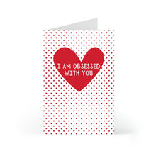 Load image into Gallery viewer, The Funny Valentine Greeting Card from R is for Robo features a large red heart encircled by smaller hearts. Inside, it reads, I am obsessed with you. Its the perfect size to express your affection.