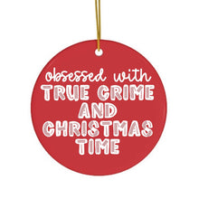 Load image into Gallery viewer, Introducing the True Crime Funny Christmas Ornament by R is for Robo, a round, red ceramic piece adorned with white lettering that declares: obsessed with TRUE CRIME AND CHRISTMAS TIME. This humorous ornament is ideal for true crime enthusiasts and includes a thin gold string for convenient hanging.