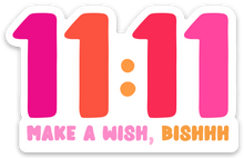 Load image into Gallery viewer, This durable vinyl sticker from R is for Robo features the numbers 11:11 in radiant shades of pink and orange, with "Make a Wish, Bishhh" shining in vibrant pink and red beneath it on waterproof material. The 11:11 Make a Wish Sticker is perfect for brightening up any surface.