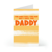 Load image into Gallery viewer, Introducing the DADDY Funny Father's Day Card for Husband by R is for Robo. This humorous greeting card features a yellow and white striped design with the playful text, "THE KIDS CALL YOU DAD BUT I CALL YOU DADDY," in vibrant red and orange letters. It's the perfect way to bring a smile to your husband this Father's Day while standing proudly upright.