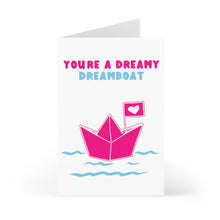 Load image into Gallery viewer, The "Cute Valentine's Day Card for Husband or Wife" by R is for Robo features a delightful pink paper boat with a heart flag gliding on wavy blue lines. Above, the playful text says, "You're a dreamy dreamboat" in charming pink and blue letters. It's an ideal way to express your feelings with charm and warmth.