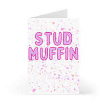 Load image into Gallery viewer, The "Stud Muffin" Funny Valentine's Day Card by R is for Robo features bold pink lettering against a playful multicolored splatter background in shades of purple and pink. Ideal for adding your own personal message, the card comes partially open for easy writing.