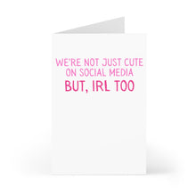 Load image into Gallery viewer, The "Cute Valentines Day Card for Boyfriend or Girlfriend" by R is for Robo features the message "We're not just cute on social media but, IRL too," printed in pink on a white background.