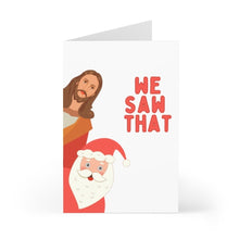 Load image into Gallery viewer, This playful Christmas card features Santa and Jesus with the text "We Saw That." It’s designed to add humor and charm to holiday greetings, combining traditional figures with a cheeky twist. The card measures 4.25 x 5.5 inches, printed on heavyweight matte paper, and comes with a red envelope.