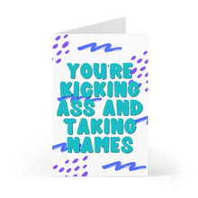 Load image into Gallery viewer, The "Kicking Ass and Taking Names Funny Congratulations Card" by R is for Robo features teal text that says "You're kicking ass and taking names" on a heavyweight matte finish with a white background. The card is accented with blue and purple abstract patterns, making it ideal for adding a handwritten note to celebrate someone's success.
