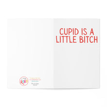 Load image into Gallery viewer, An Anti Valentine's Day card, perfect for Galentine's Day, features the bold red text "CUPID IS A LITTLE BITCH" on the right. On the left side, it proudly showcases the R is for Robo logo and website details. The card is open against a plain background, inviting smiles and giggles.