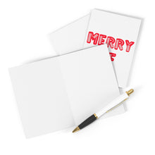 Load image into Gallery viewer, A blank greeting card and a pen rest on a surface, crafted from heavyweight matte card. Behind them, the Merry AF Christmas Card by R is for Robo boldly showcases the word MERRY in red letters.
