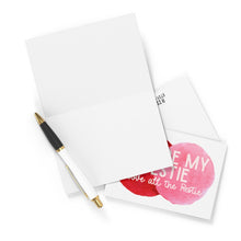 Load image into Gallery viewer, A blank card and a pen sit next to an envelope and the Bestie Above the Restie Best Friend Card from R is for Robo, featuring pink watercolor circles. The greeting card reads, "You're my Bestie, you're all the Bestie," inviting a personal touch with a handwritten note inside.