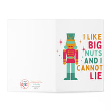 Load image into Gallery viewer, Introducing the "Nutcracker Big Nuts Funny Christmas Card for Him or Her" by R is for Robo. This card showcases whimsical nutcracker art and features a toy soldier illustration set against a clean, white background. To the right, playful fonts spell out "I Like Big Nuts and I Cannot Lie," adding humor to this perfect Christmas card for spreading holiday cheer.