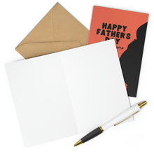 Load image into Gallery viewer, A blank card and white pen rest beside a brown envelope. A "First Fathers Day Card from the Baby Bump" by R is for Robo, featuring "Happy Father's Day" in black text on an orange cover, peeks out, ready to celebrate the special Daddy-to-Be.