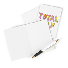 Load image into Gallery viewer, An open Father's Day greeting card from R is for Robo awaits your personal touch, with a gold and black pen placed beside it. In the background, a vibrant card featuring the text "Total DILF" stands out beautifully. All items rest against a white backdrop, inviting you to add your heartfelt handwritten message.