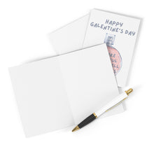 Load image into Gallery viewer, A blank greeting card is open on a white surface with a pen beside it, ready for your handwritten note. The "You Smell Like Roses Galentine's Day Card" by R is for Robo, featuring a charming perfume bottle illustration and the message "Happy Galentine's Day," peeks out from underneath, adding charm to the setting.