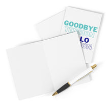 Load image into Gallery viewer, An unadorned greeting card lies open alongside an envelope and a pen. Another card, the "Goodbye Tension Hello Pension Funny Retirement Card" by R is for Robo, is partially visible with its playful text in teal and blue letters, making it an ideal choice for a humorous retirement message. The pen accompanying them is white with black and gold accents.