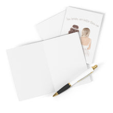 Load image into Gallery viewer, Introducing the Two Brides Wedding Card by R is for Robo: a captivating heavyweight matte card featuring an illustration of two brides alongside the text "Two brides are better than one." This card is perfect for celebrating a lesbian wedding and comes with a sleek black and gold pen, ideal for adding your personal handwritten message.