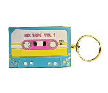 Load image into Gallery viewer, Introducing the Cassette Tape Keychain by R is for Robo, designed for 90s Kids. This keychain boasts a Retro Flair with its vibrant pink, yellow, and blue colors and features "Mix Tape Vol. 1" inscribed on it. It’s elegantly adorned with small heart details in the bottom corners that encapsulate the perfect Vintage Charm.