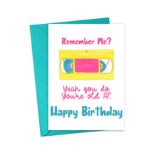 Load image into Gallery viewer, Product: 90s Retro Neon You're Old AF Funny Birthday Card by R is for Robo
Description: This sassy birthday card comes with a teal envelope and features an eye-catching yellow VHS tape illustration. It proudly displays the message: "Remember Me? Yeah you do. You're old AF. Happy Birthday." Perfect for adding a humorous 90s retro neon vibe to your special day.