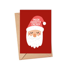 Load image into Gallery viewer, The Main Character Energy Funny Christmas Card by R is for Robo features a charming cartoon Santa Claus with closed eyes, radiating Main Character Energy. It's printed on heavyweight matte card and comes with a red greeting card paired with a brown envelope, bringing an extra touch of charm to your holiday season.