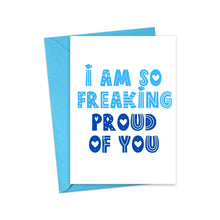 Load image into Gallery viewer, The "I am So Freaking Proud Congratulations Card" by R is for Robo comes with a blue envelope and features bold, fun letters in shades of blue that spell out "I am so freaking proud of you," accented with heart designs within the letters. This heavyweight matte card is perfect for adding a heartfelt, handwritten note inside.
