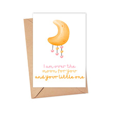 Load image into Gallery viewer, The Over the Moon Baby Card by R is for Robo is a heavyweight matte card showcasing an illustration of a crescent moon with hanging hearts. The card contains the text, "I am over the moon for you and your little one," and comes with a brown envelope ideal for a handwritten note.