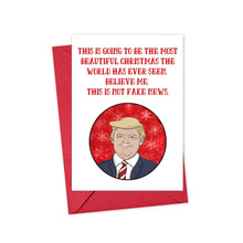 Load image into Gallery viewer, The "Donald Trump Christmas Card Funny" by R is for Robo is a humorous holiday card featuring an illustration of a man in a suit and tie with the text, "This is going to be the most beautiful Christmas the world has ever seen. Believe me, this is not fake news." It comes with a red envelope and is perfect for those who enjoy topical humor.