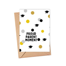 Load image into Gallery viewer, Introducing the Proud Parents Graduation Card for Son or Daughter by R is for Robo. This card features the bold black phrase "Proud Parent Moment" and a design of black graduation caps alongside gold, grey, and black polka dots on a white background. It comes with a brown envelope, making it ideal for inserting a heartfelt, hand-written note from proud parents.