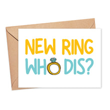 Load image into Gallery viewer, The "New Ring Who Dis Funny Engagement Card" from R is for Robo comes with a brown envelope and showcases the bold text NEW RING WHO DIS? in vibrant yellow and blue. A whimsical illustration of a diamond ring takes the place of the O in WHO, adding a humorous twist that makes it an ideal choice for celebrating engagements.